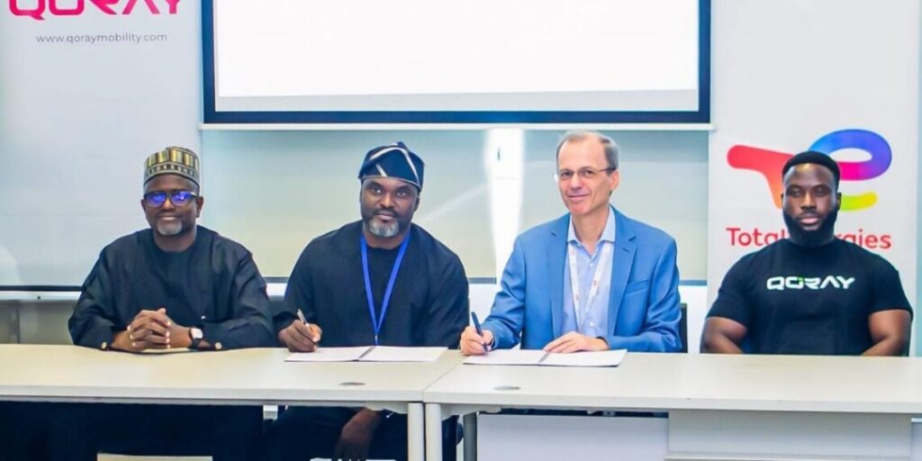 Qoray and TotalEnergies executives during electric vehicle partnership agreement