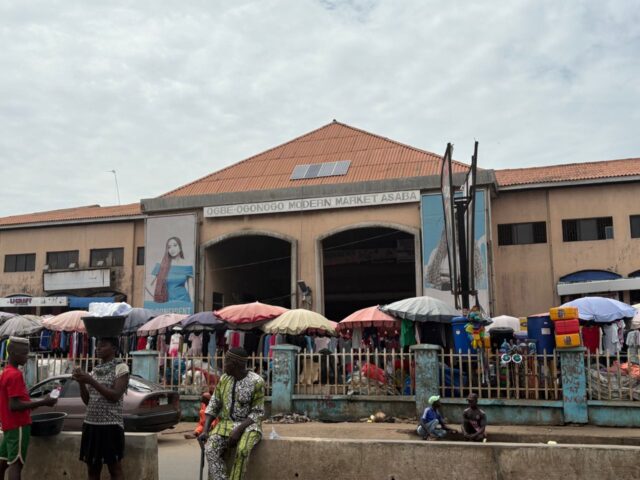 Technicians repairing smartphones inside Asaba Computer Village in Ogbeogonogo Market, Delta State