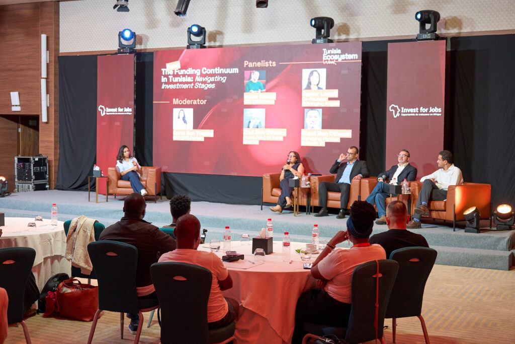 Participants listening to a panel session